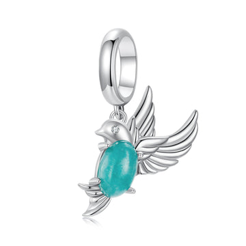 Silver pendant with a turquoise stone on a white background
