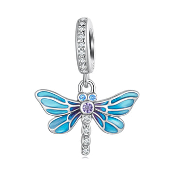 Blue butterfly charm with clear gemstones on a white background