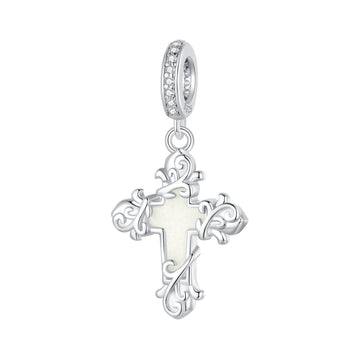 Silver cross pendant with a white center on a white background