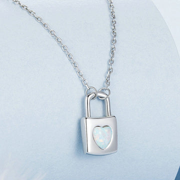 Silver necklace with a lock-shaped pendant on a light blue background