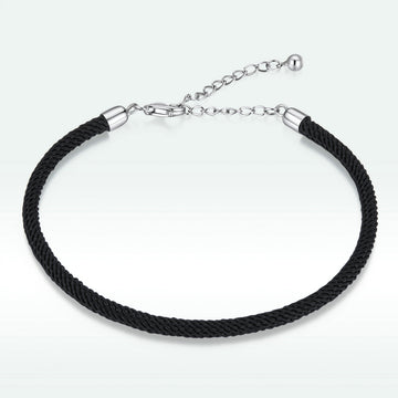 Black braided bracelet with silver clasp on a white background