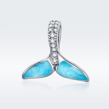 Jewelry pendant with turquoise stones and diamond accents on a white background