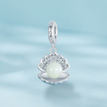 Silver pendant with a pearl on a light blue background