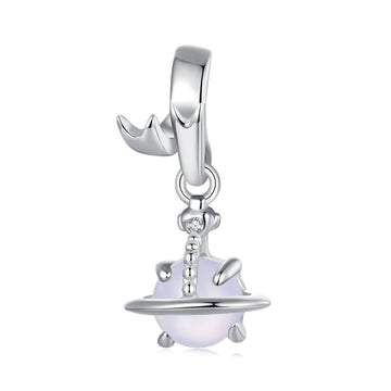 Silver charm with a white bead on a white background