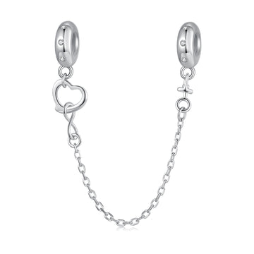 Silver earring with heart charm and chain on a white background