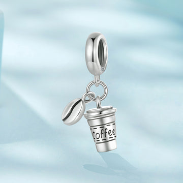 Silver charm shaped like a coffee cup with 'Coffee' text on a light blue gradient background