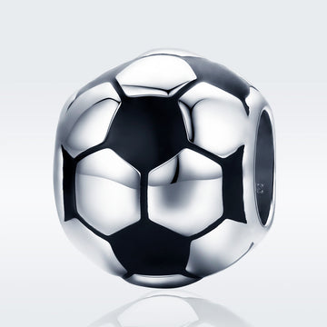 Silver soccer ball charm on a light gray background