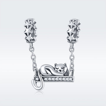 Silver cat charm on a chain with a white background