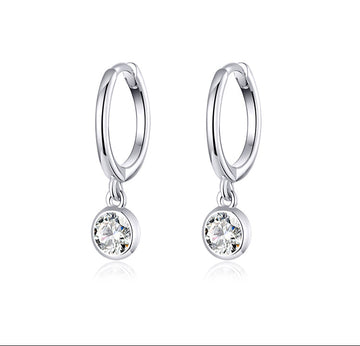Silver zirconia ear clips on a white background with text 'As Unique As You' and 'Zirconia Ear Clip'.