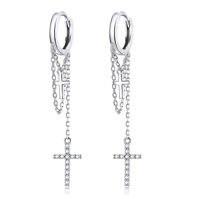 Silver hoop earrings with chain and cross pendants on a white background