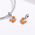Two orange crab-shaped charms on silver bracelets against a white background