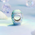 Decorative blue and silver object on a light blue background