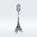 Silver Eiffel Tower charm with clear gemstones on a white background