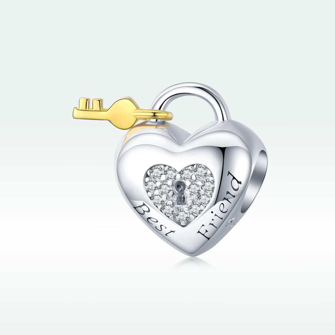 Heart-shaped silver lock with a gold key on a white background