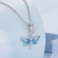 Butterfly-shaped pendant on a chain against a light blue background