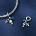 Silver bracelet with charms on a blue background