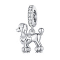 Silver poodle charm with a clear gemstone on a white background