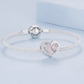 Silver bracelet with heart-shaped charm and 'Forever Yours' bead on a light blue background