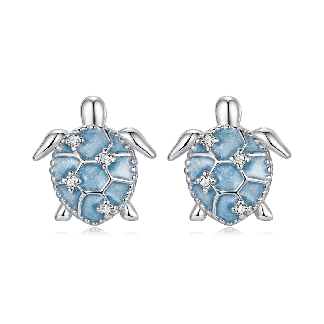 Turtle-shaped earrings with blue enamel and clear stones on a white background