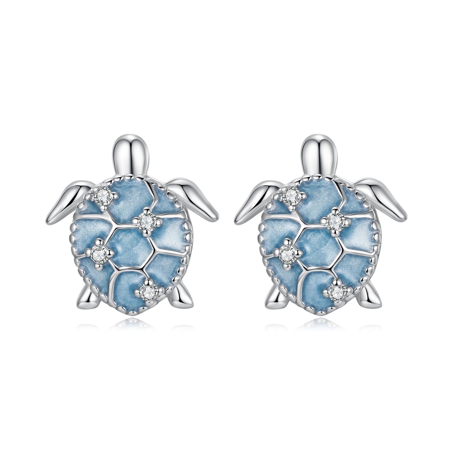 Turtle-shaped earrings with blue enamel and clear stones on a white background