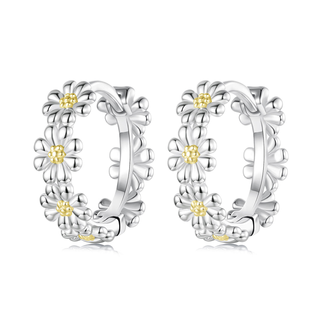 Pair of silver hoop earrings with floral designs on a white background