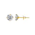 Gold stud earrings with clear gemstones on a white background