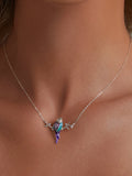 Necklace with a colorful pendant on a person's neck, highlighting jewelry design.