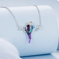 Necklace with a bird-shaped pendant on a light blue background