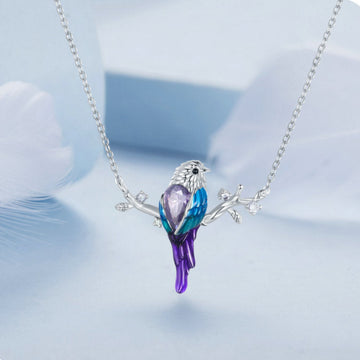 Necklace with a bird-shaped pendant on a light blue background