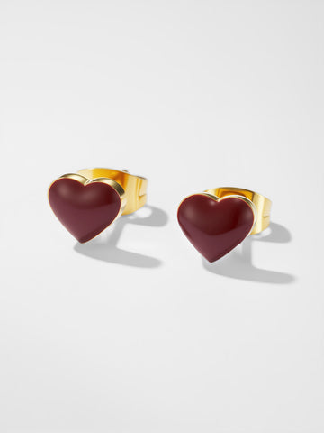 Heart-shaped earrings with gold rims on a white background