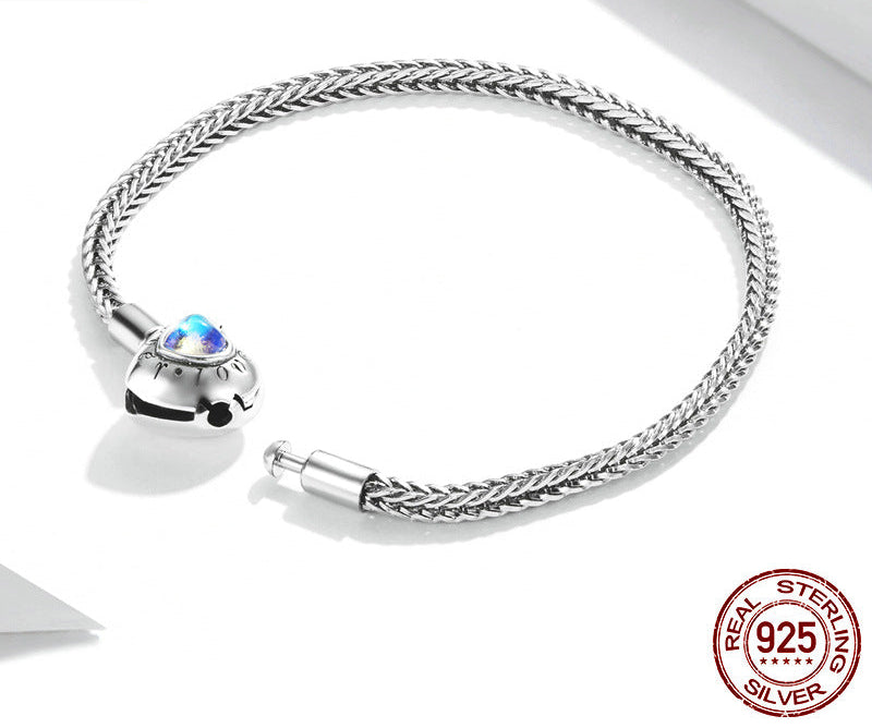 Silver bracelet with heart-shaped clasp on a white background, featuring YIZIV branding.