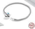 Silver bracelet with a clear gemstone on a white background, featuring the YIZIV brand.