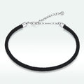Black braided bracelet with silver clasp on a white background