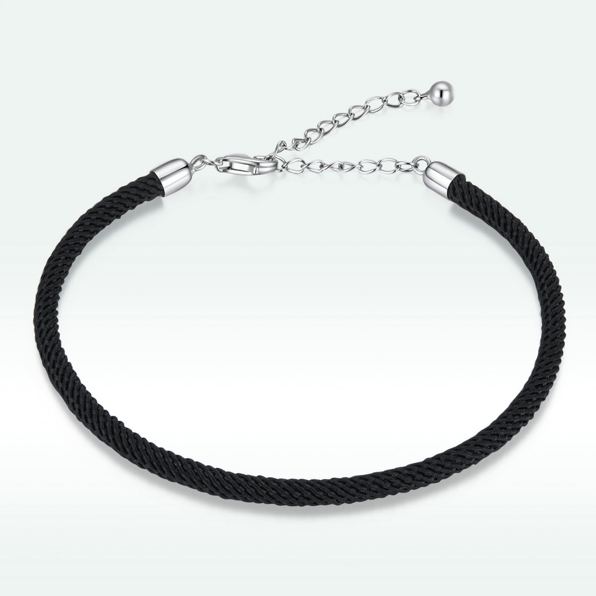 Black braided bracelet with silver clasp on a white background