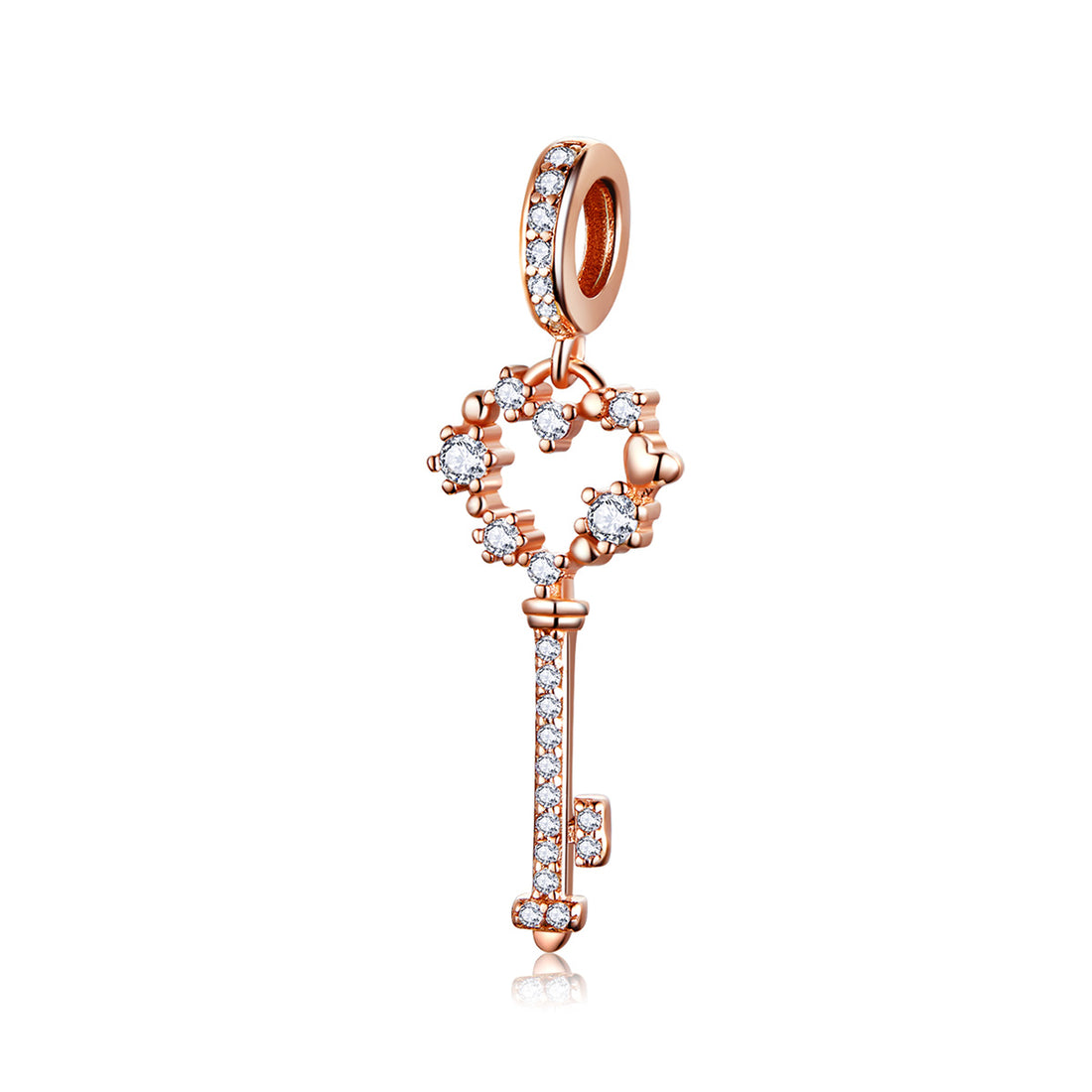 Rose gold key-shaped pendant with diamonds on a pastel background