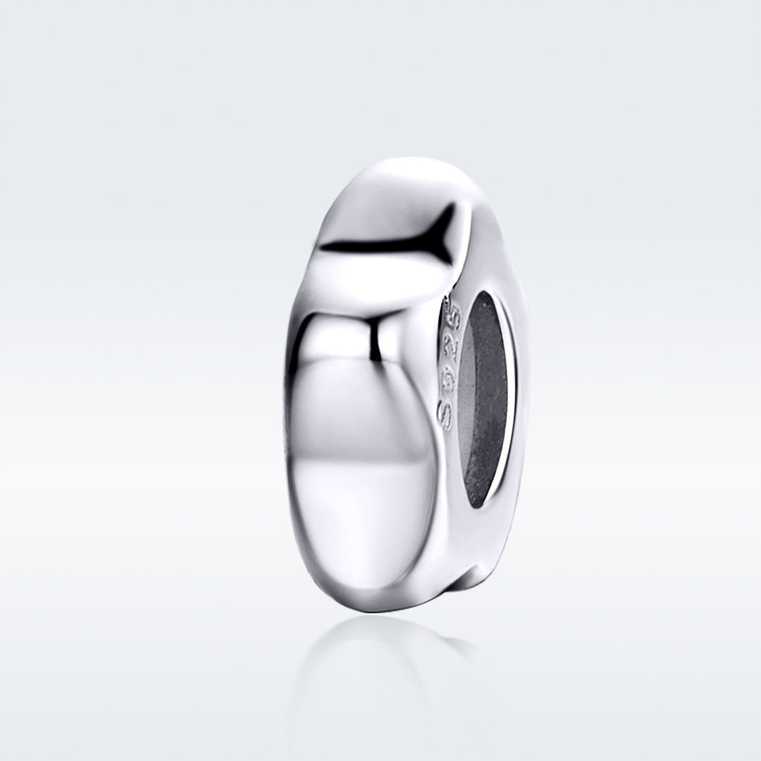 Silver ring on a light gray background