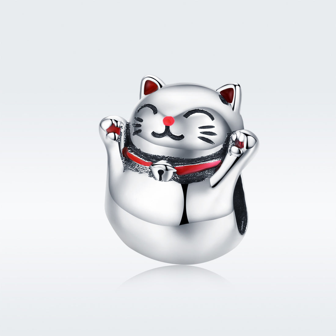 Silver cat-shaped charm on a light gray background