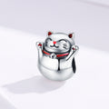 Silver cat-shaped charm on a light gray background