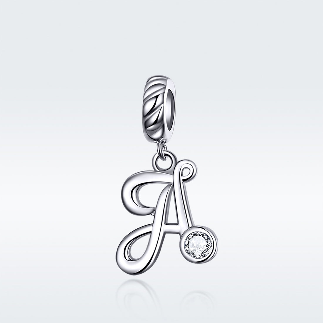 Silver pendant with letter 'A' and small round gemstone on a light gray background