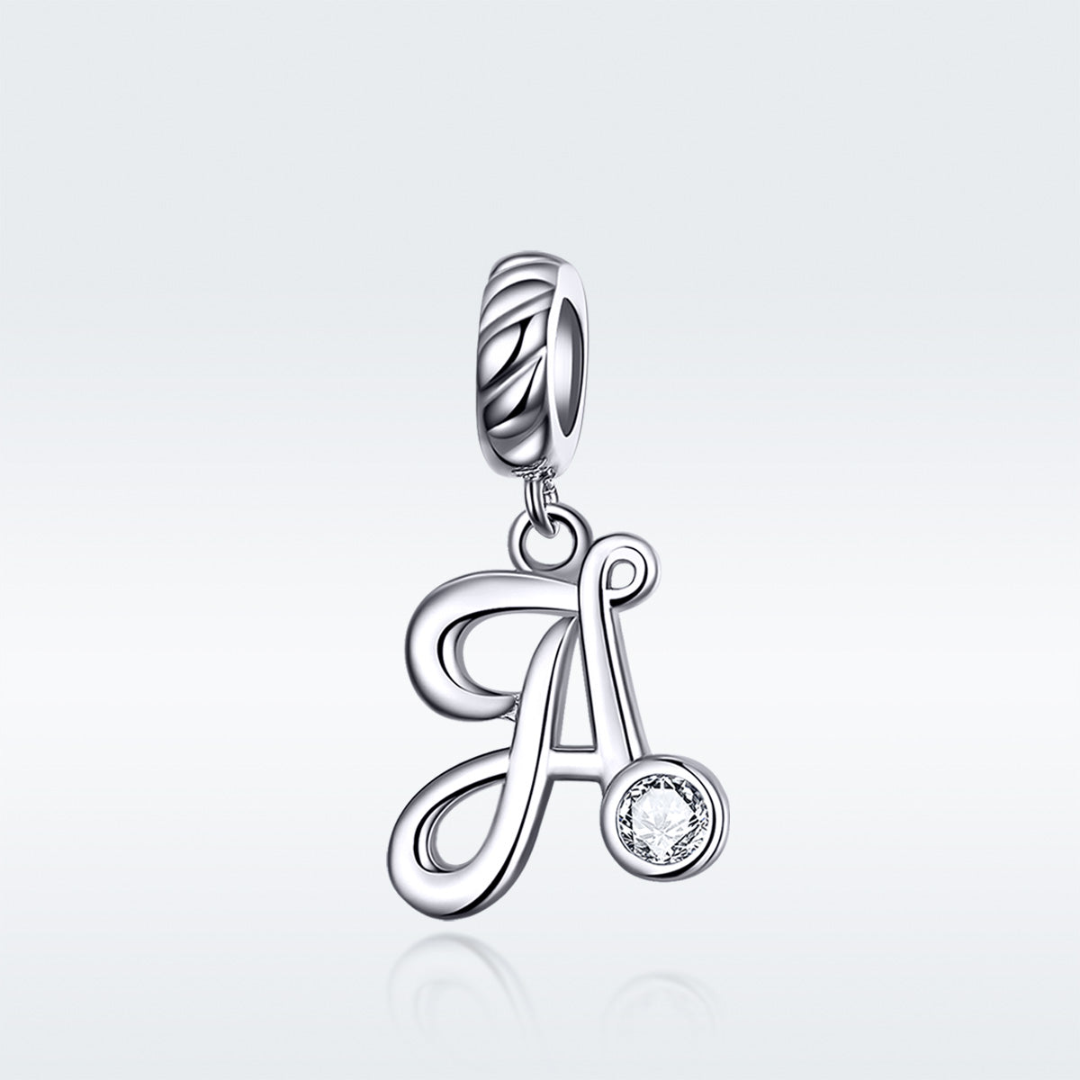 Silver pendant with letter 'A' and small round gemstone on a light gray background