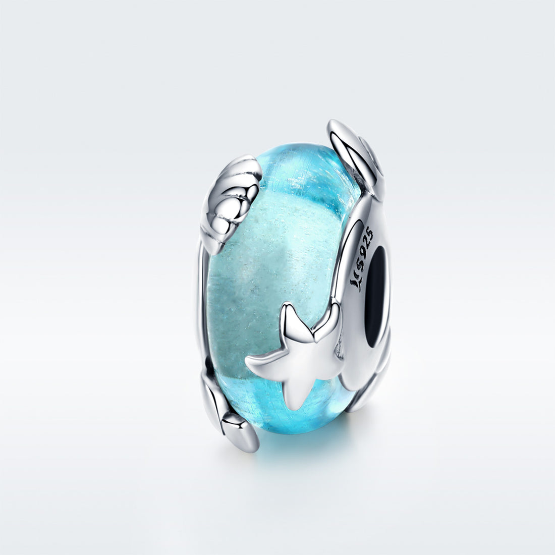 Blue glass charm with silver star design on a light gray background