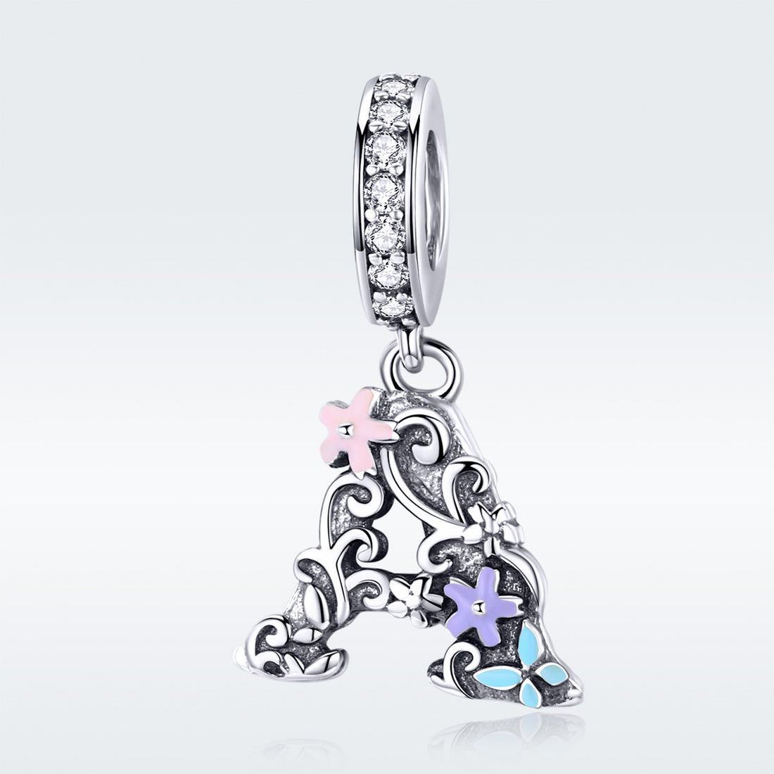 Silver pendant with floral designs and colorful stones on a white background