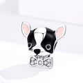 Dog-shaped charm with a bow tie on a white background