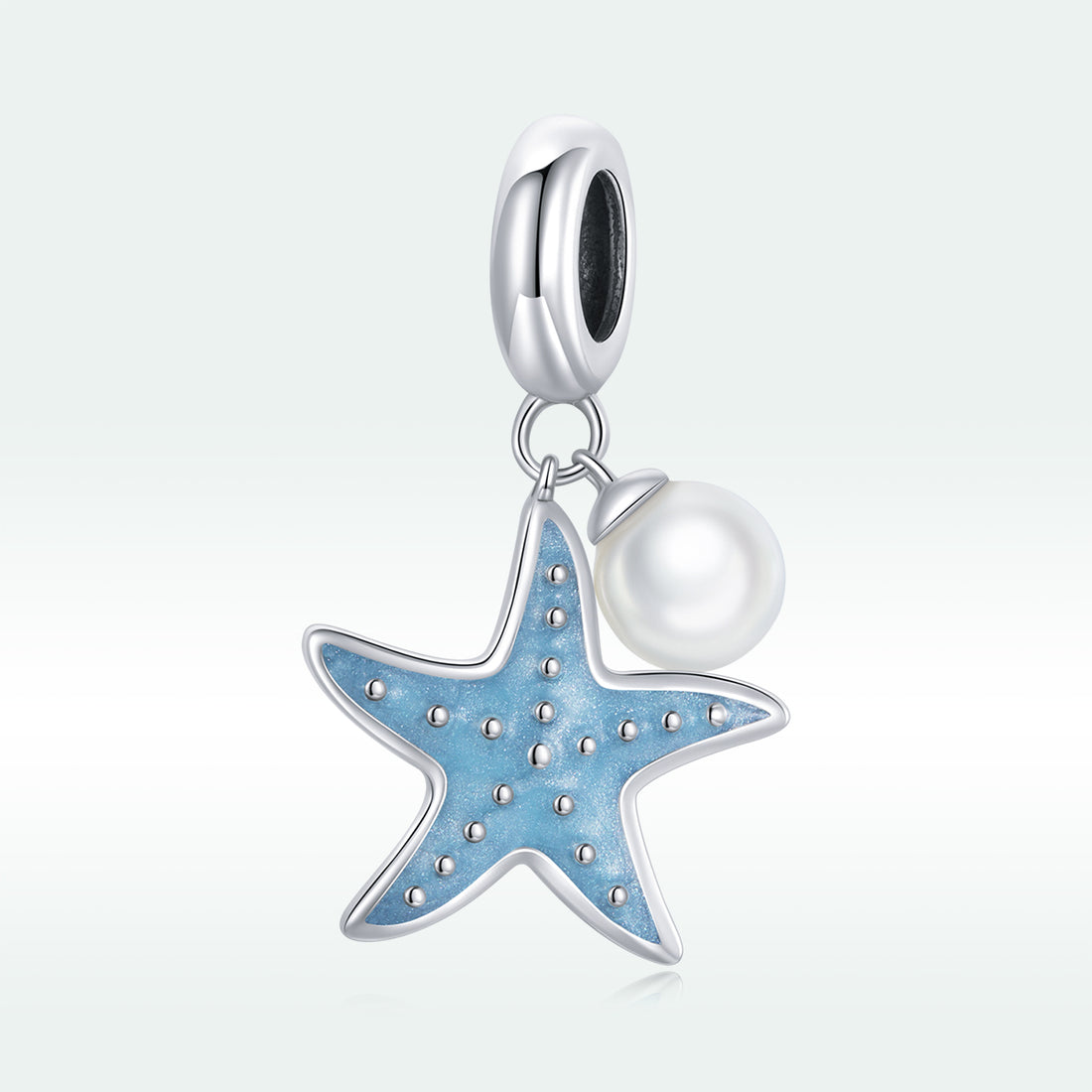 Starfish and pearl charm on a white background