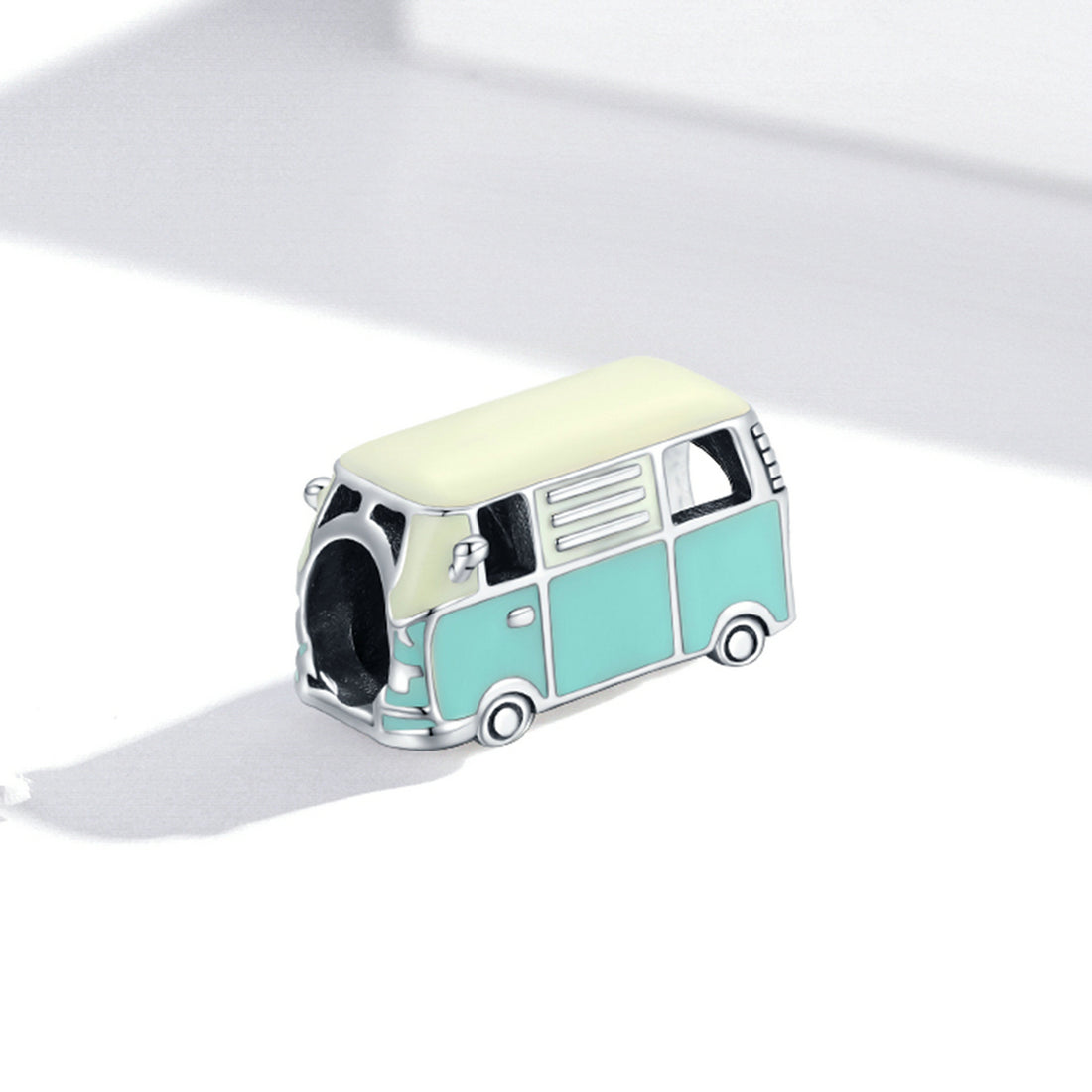 Teal and white van-shaped object on a white background