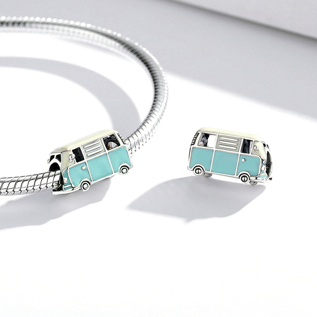 Teal and white van-shaped object on a white background