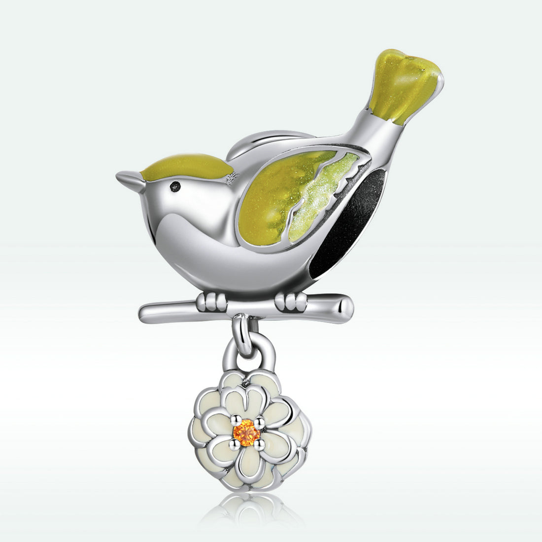 Silver charm shaped like a bird with green accents on a white background