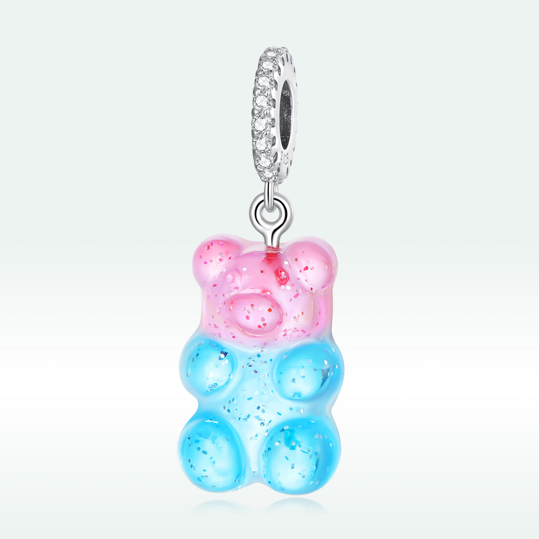 Gummy bear-shaped pendant with pink top and blue bottom on a white background