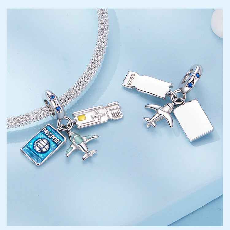 Charm with passport, airplane, and ticket on a white background