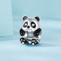 Panda-shaped silver charm on a light blue background